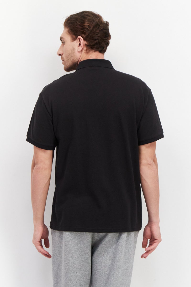 PUMA قمصان بولو تدريبية بشعار العلامة التجارية للرجال بتصميم مريح، أسود - Image 2